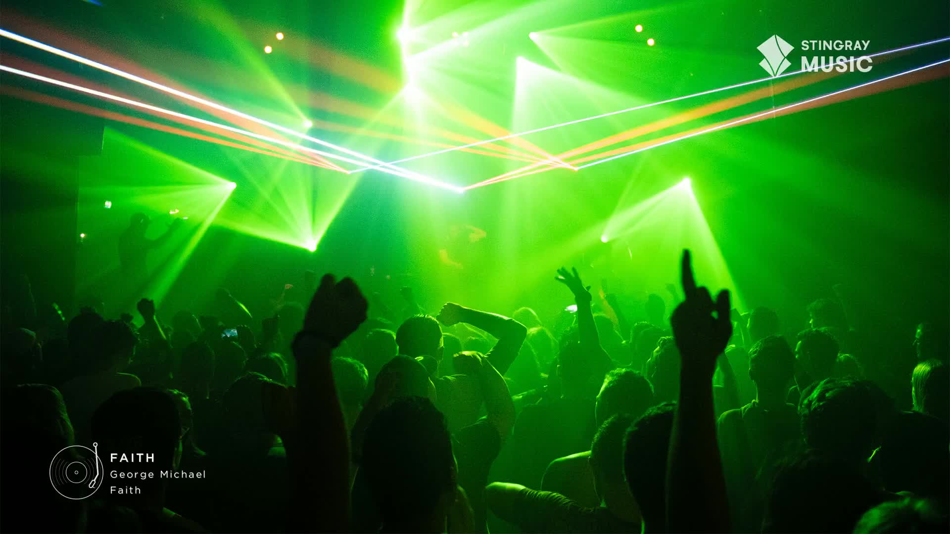 Green lights slice through the air above a crowd, illuminating raised arms and dancing figures. Everyone is moving to the music, a classic from the '80s, on this Stingray Everything '80s night in Canada.

