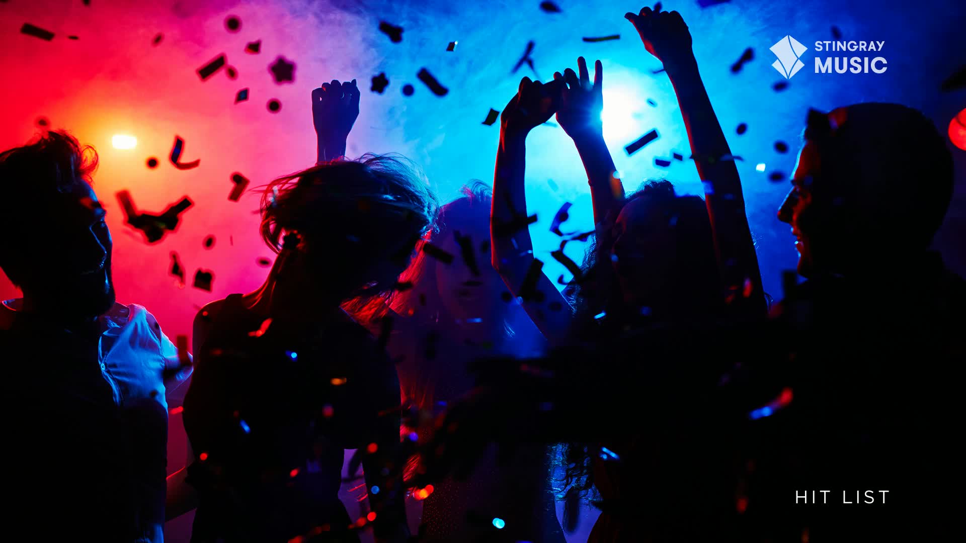 People are dancing, their arms raised in the air under a wash of red and blue lights, and confetti rains down on them. This must be a Stingray Hit List party in Canada.
