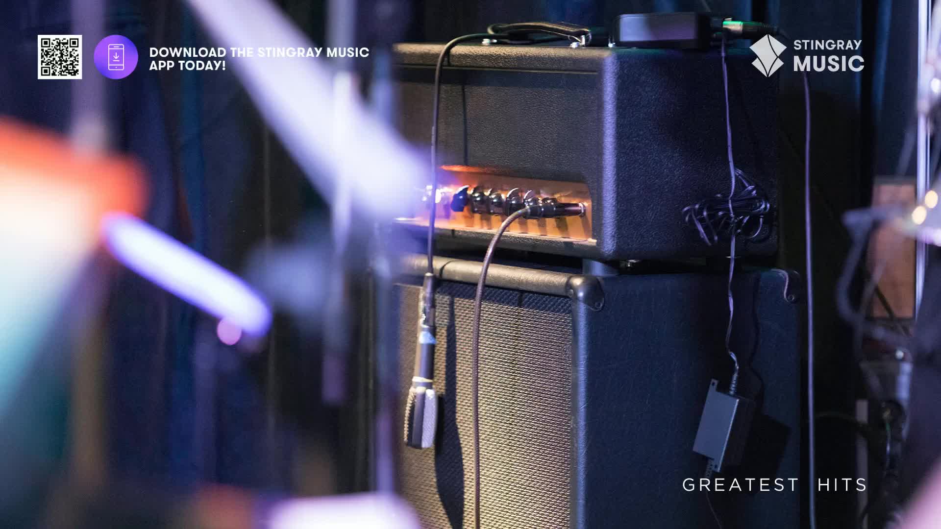 The stage lights are casting a hazy glow across the amps, and a microphone hangs in front of the speaker. It looks like a Stingray Holiday Hits concert in Canada is about to start.

