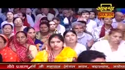 The audience, mostly women, are seated and looking toward the stage. A logo for Aastha Bhajan is visible, and the scene appears to be a devotional gathering in India.
The audience, mostly women, are seated and looking toward the stage. A logo for Aastha Bhajan is visible, and the scene appears to be a devotional gathering in India.