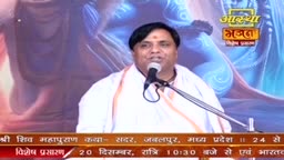 A man in white robes speaks into a microphone, his expression animated. The Aastha Bhajan logo is visible in the corner, and text at the bottom indicates a broadcast from India.
A man in white robes speaks into a microphone, his expression animated. The Aastha Bhajan logo is visible in the corner, and text at the bottom indicates a broadcast from India.