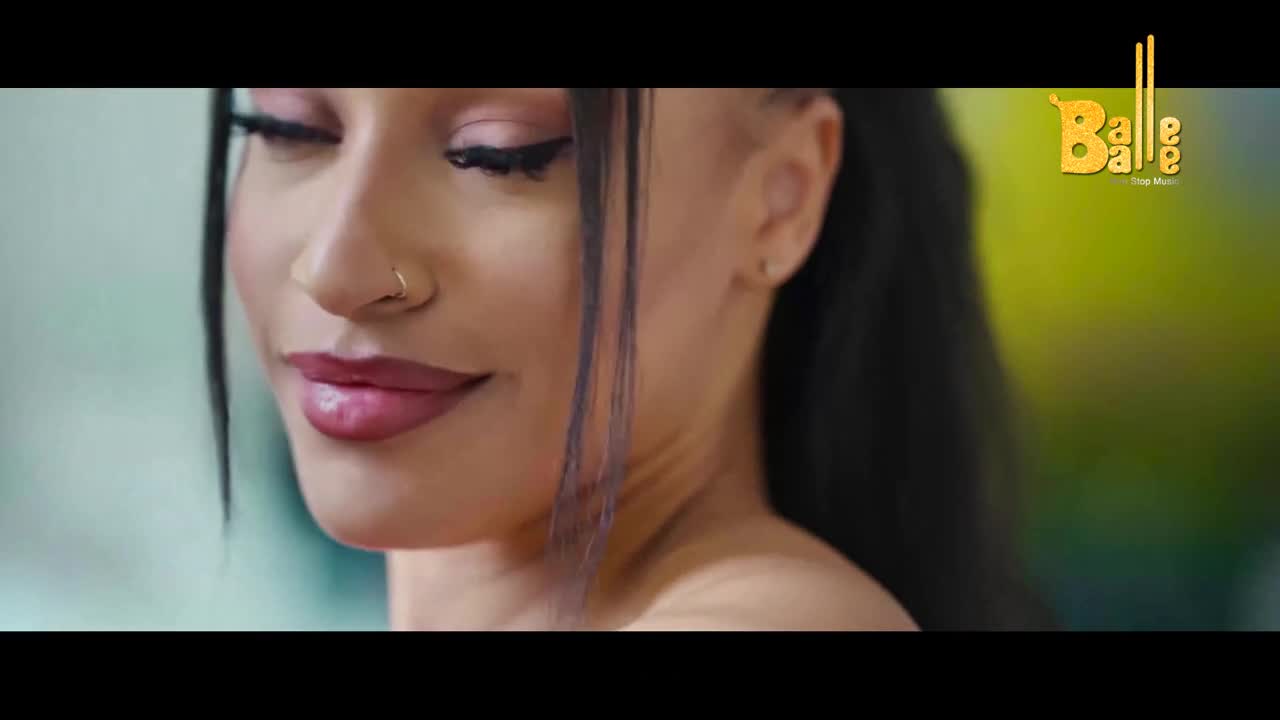 A woman with a nose ring and bold eye makeup smiles softly. The Balle Balle logo appears in the upper right corner.