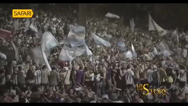 A massive crowd waves light blue and white flags, their arms raised in celebration. The "Safari" logo appears in the top left corner of the screen.