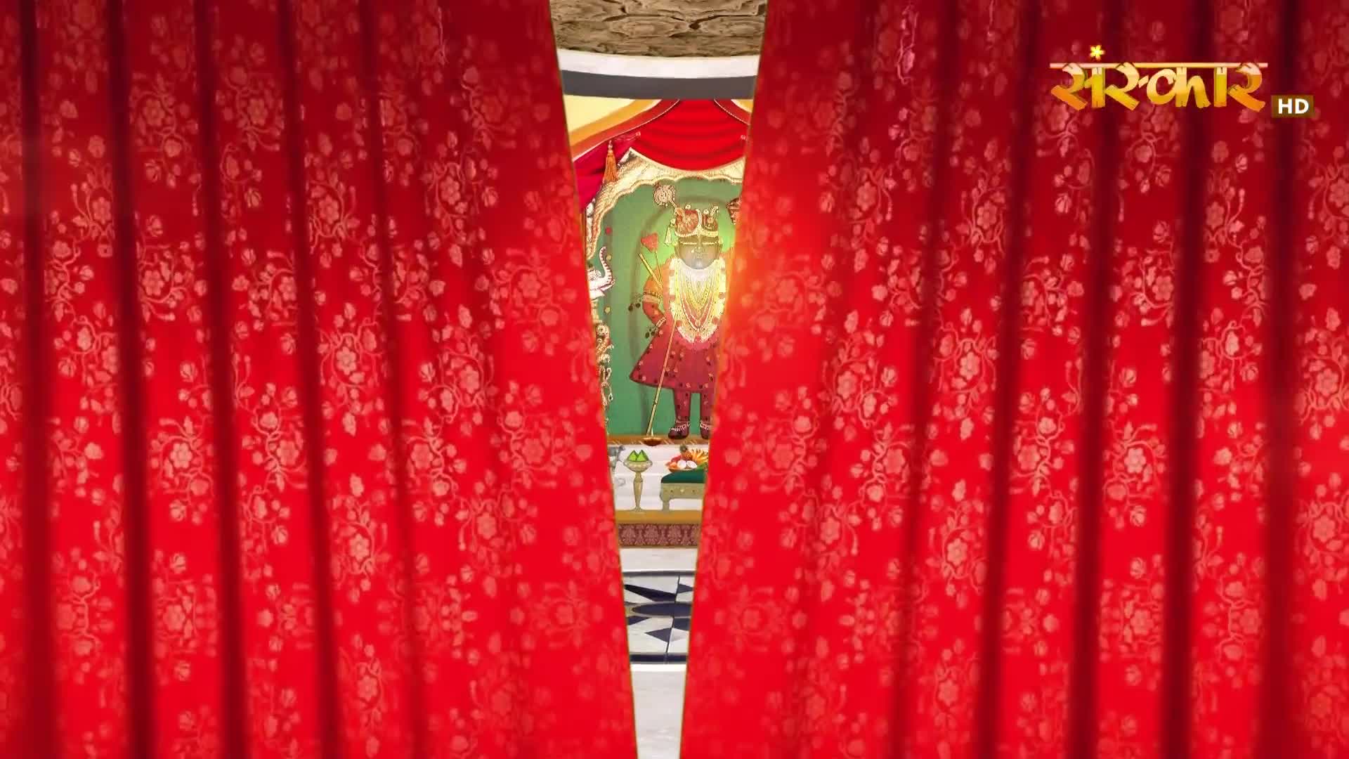 The ornate red curtains part to reveal a brightly lit altar. A divine figure, adorned in red and gold, stands serenely behind a golden railing.