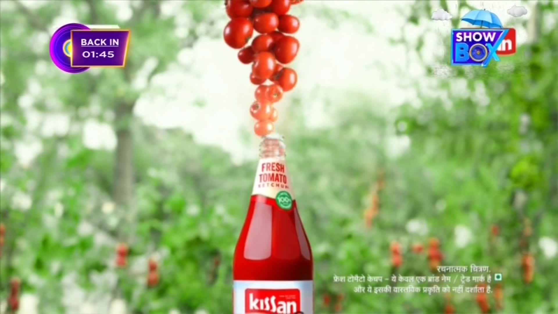 A bottle of Kissan fresh tomato ketchup stands centered, with a stream of tomatoes seemingly pouring into it. The ShowBox logo and a "Back in 01:45" timer are visible, suggesting a commercial break.
