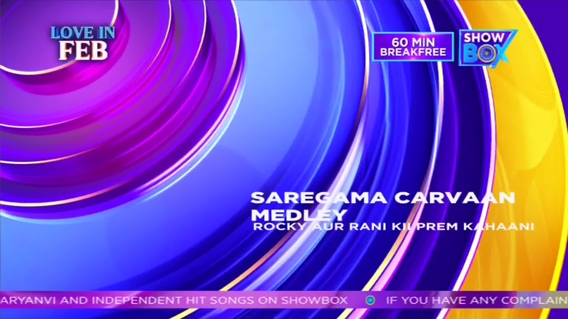 A "Saregama Carvaan Medley" from "Rocky Aur Rani Kii Prem Kahaani" is playing. The screen flashes "Love in Feb" and "60 Min Breakfree" on Showbox. A "Saregama Carvaan Medley" from "Rocky Aur Rani Kii Prem Kahaani" is playing. The screen flashes "Love in Feb" and "60 Min Breakfree" on Showbox.