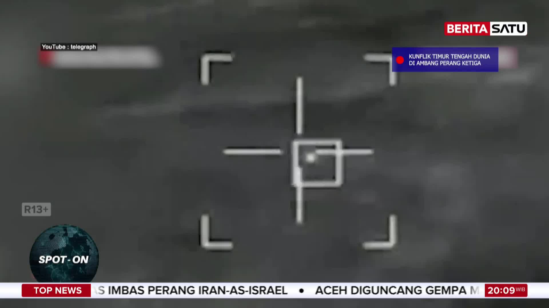 A crosshair hovers over a grainy, indistinct background. Berita Satu's logo is visible in the upper right corner, with text below it in Indonesian. A crosshair hovers over a grainy, indistinct background. Berita Satu's logo is visible in the upper right corner, with text below it in Indonesian.