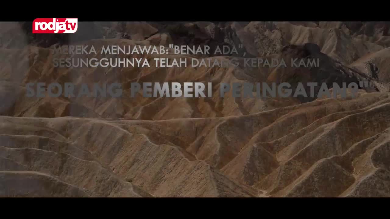 The Rodja TV logo sits above Indonesian text describing a warning. The stark, arid landscape stretches out before me.
