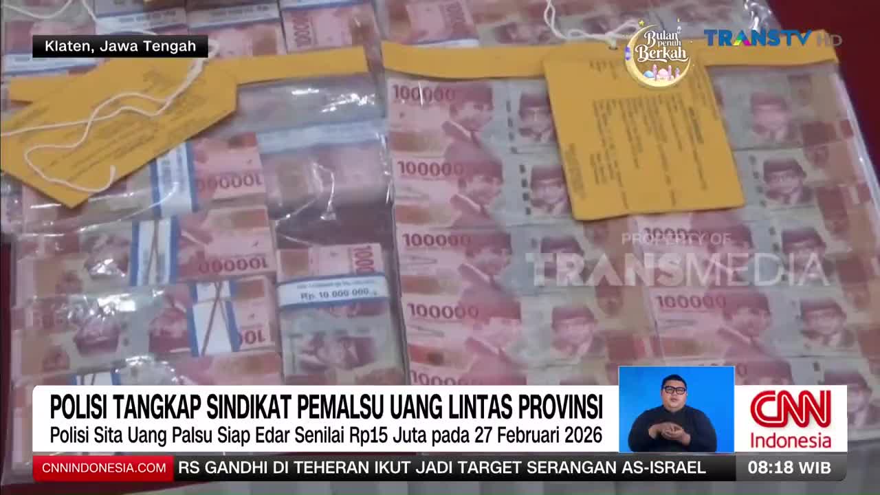 Stacks of Indonesian rupiah banknotes, each marked "100000," are neatly arranged in clear plastic. A yellow tag, likely a police evidence marker from Klaten, Jawa Tengah, rests on top of the money.