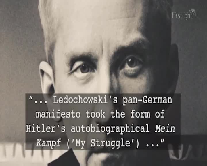A black and white photograph shows a close-up of a man's face. Text overlays the image, featuring a quote about a manifesto. A black and white photograph shows a close-up of a man's face. Text overlays the image, featuring a quote about a manifesto.