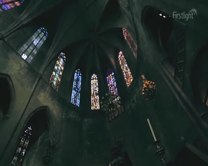 Sunlight streams through stained-glass windows, casting vibrant colours across the vaulted ceiling of this old church. A single white candle stands tall in its ornate holder, waiting for the evening service. Sunlight streams through stained-glass windows, casting vibrant colours across the vaulted ceiling of this old church. A single white candle stands tall in its ornate holder, waiting for the evening service.
