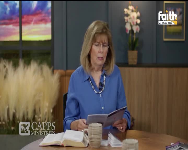 A woman in a blue shirt reads from a booklet, her brow furrowed in concentration. Beside her, a Bible lies open on the table, a mug sits nearby, and the Faith TV logo is visible in the corner.