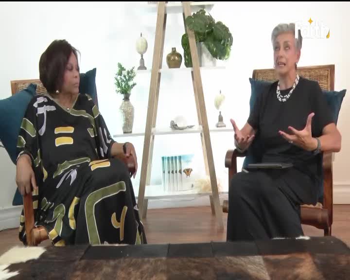 Two women sit in chairs, one in a vibrant African-print dress, the other in a black outfit, gesturing as if in conversation. The Faith TV logo is visible in the corner, suggesting this is a broadcast from South Africa.