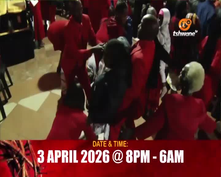 People in red suits move together in a tight circle. The Tshwane TV logo is visible in the background. People in red suits move together in a tight circle. The Tshwane TV logo is visible in the background.