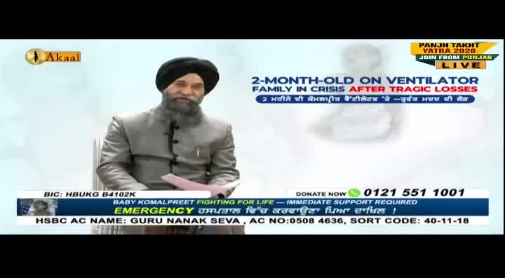 A man in a turban and suit speaks, holding papers, with a graphic about a baby on a ventilator behind him. The Akaal Channel logo is visible, along with a phone number for donations.

