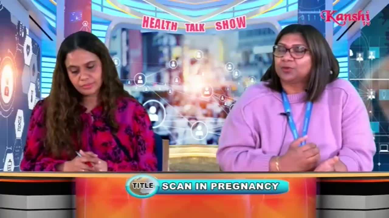Two women sit at a desk, one with her head bowed, the other speaking animatedly. A graphic behind them reads "HEALTH TALK SHOW" and "SCAN IN PREGNANCY," with the Kanshi TV logo visible.