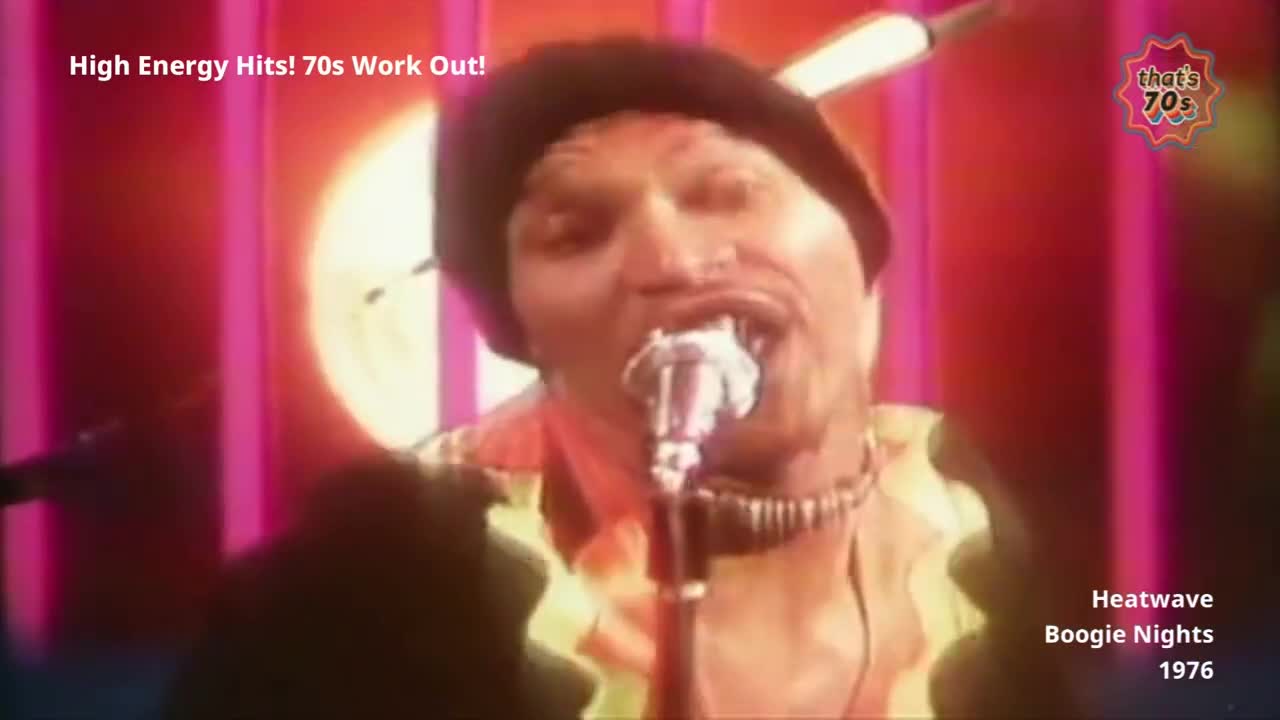 A man in a beret belts into a microphone, his colourful shirt catching the stage lights. The backdrop is a vibrant display of pink and orange, pulsing with the energy of a 1976 performance.