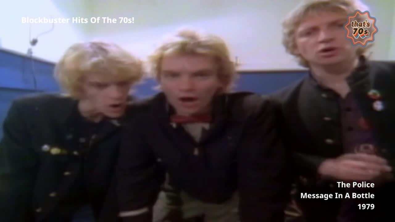 Three young men with blonde hair lean forward, their mouths open as if singing. They wear dark jackets, one with a red bow tie.