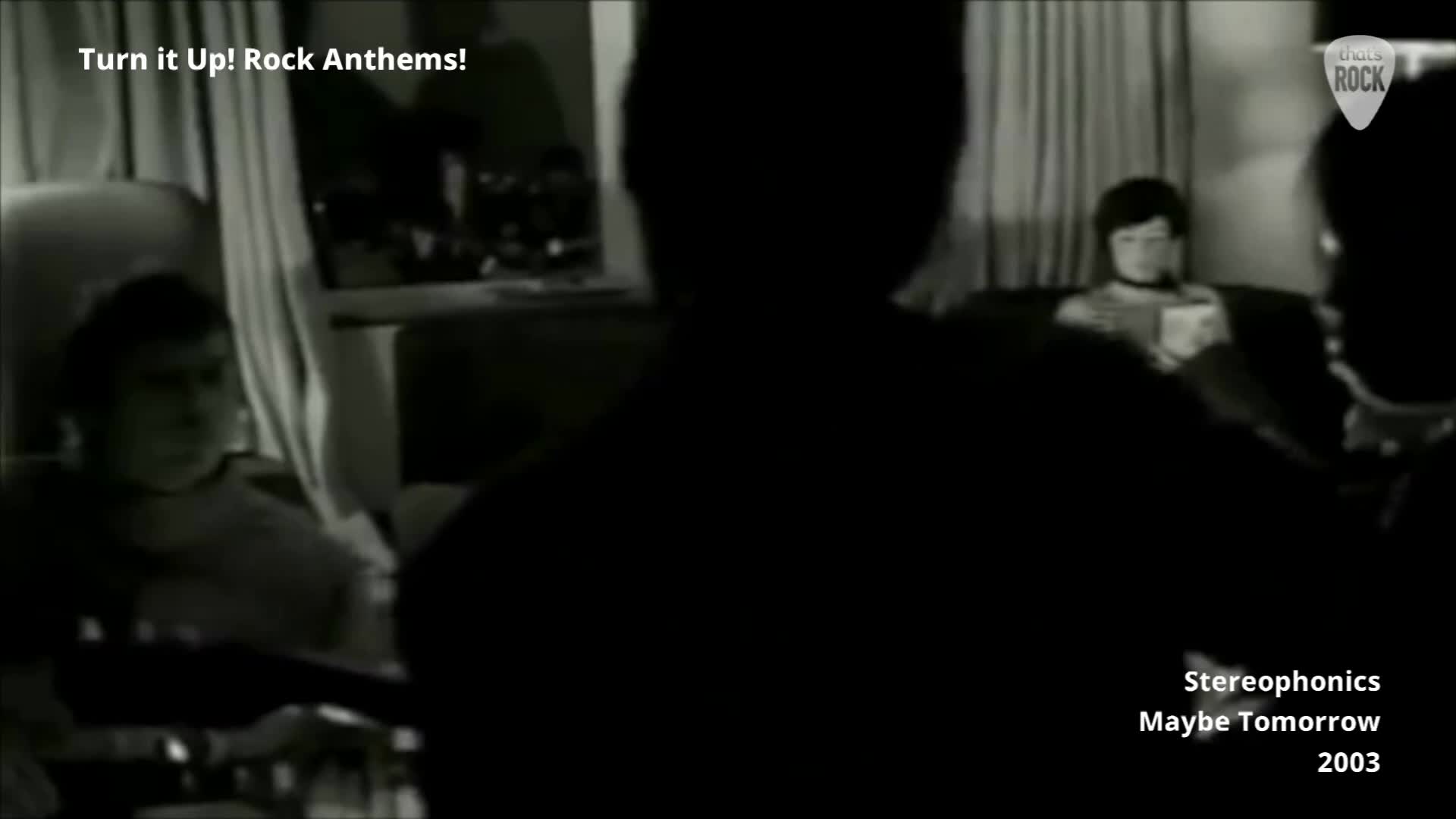 A few figures are gathered in a dimly lit room, with one person in the background reading. The Stereophonics' song "Maybe Tomorrow" plays, a track from 2003.
