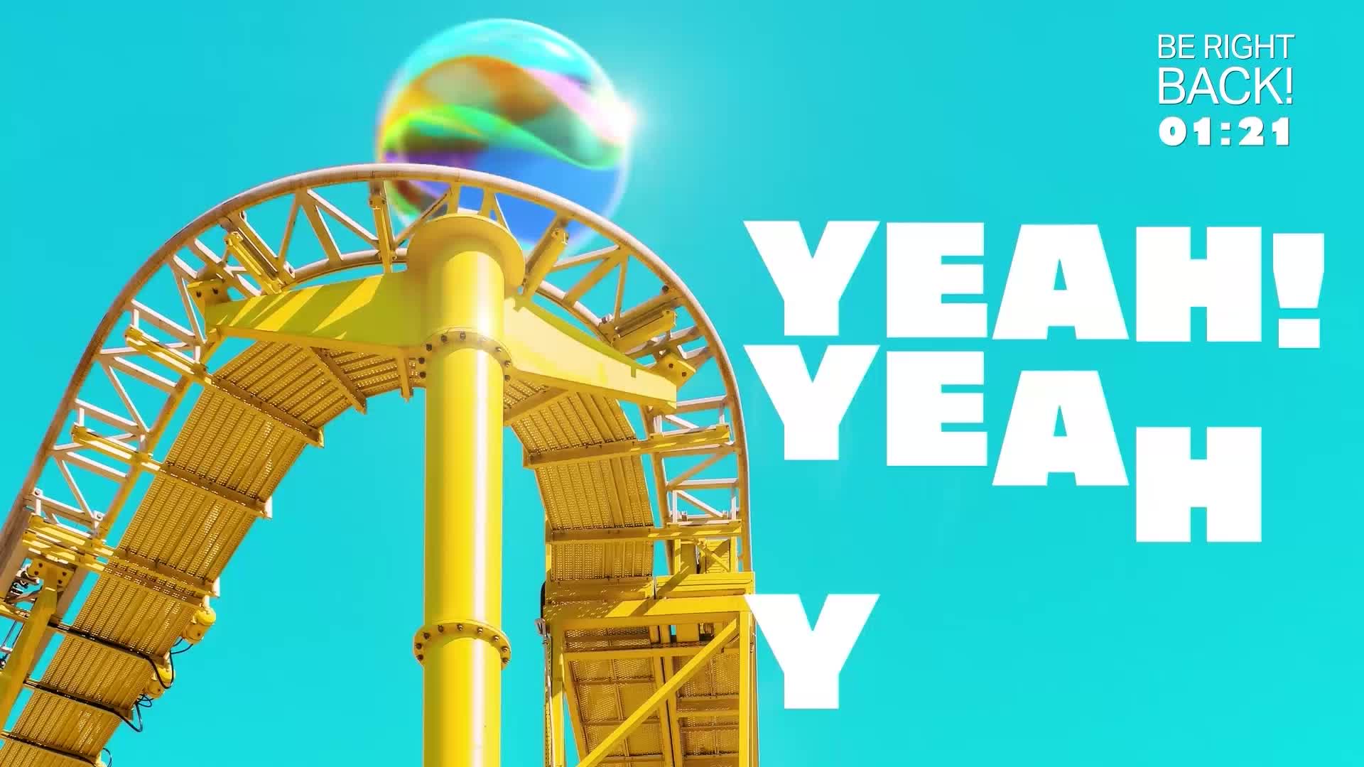 A bright yellow roller coaster track curves upwards against a clear blue sky. A giant, iridescent sphere hovers just above the peak of the loop.