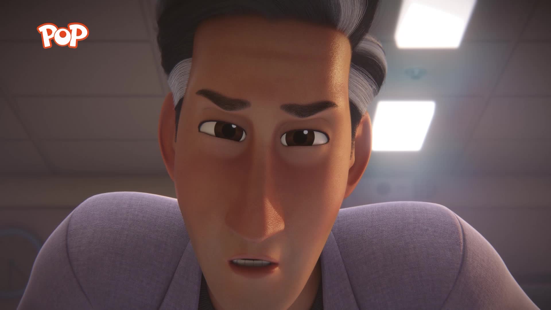 A man with grey streaks in his dark hair leans forward, his brow furrowed in concentration. The POP logo is visible in the top left corner.