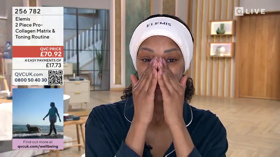 A woman applies cream to her face, her hands moving gently over her skin. The QVC logo is visible, and a graphic displays product details and pricing.
