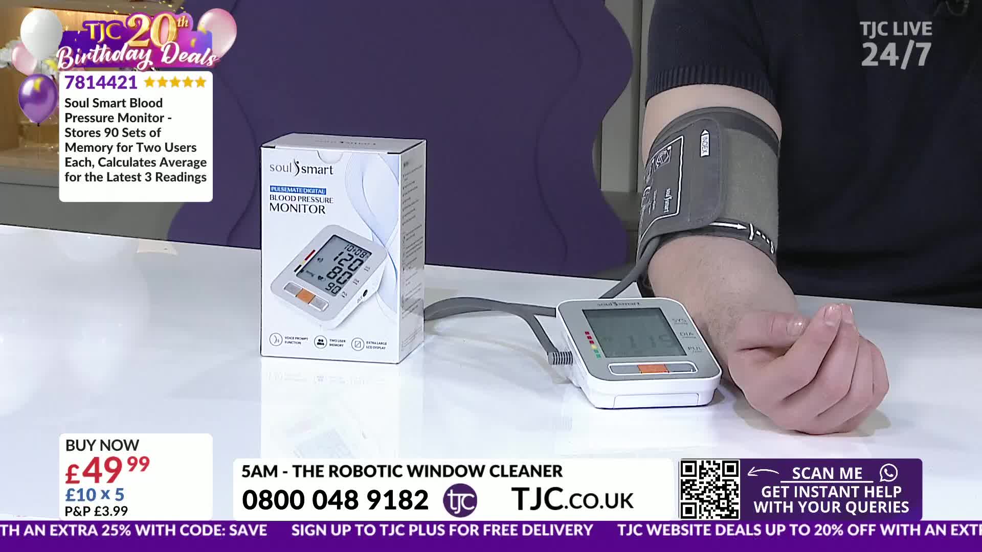 A blood pressure cuff tightens around an arm, connected to a digital monitor. Beside it, a boxed Soul Smart blood pressure monitor sits on a white surface.