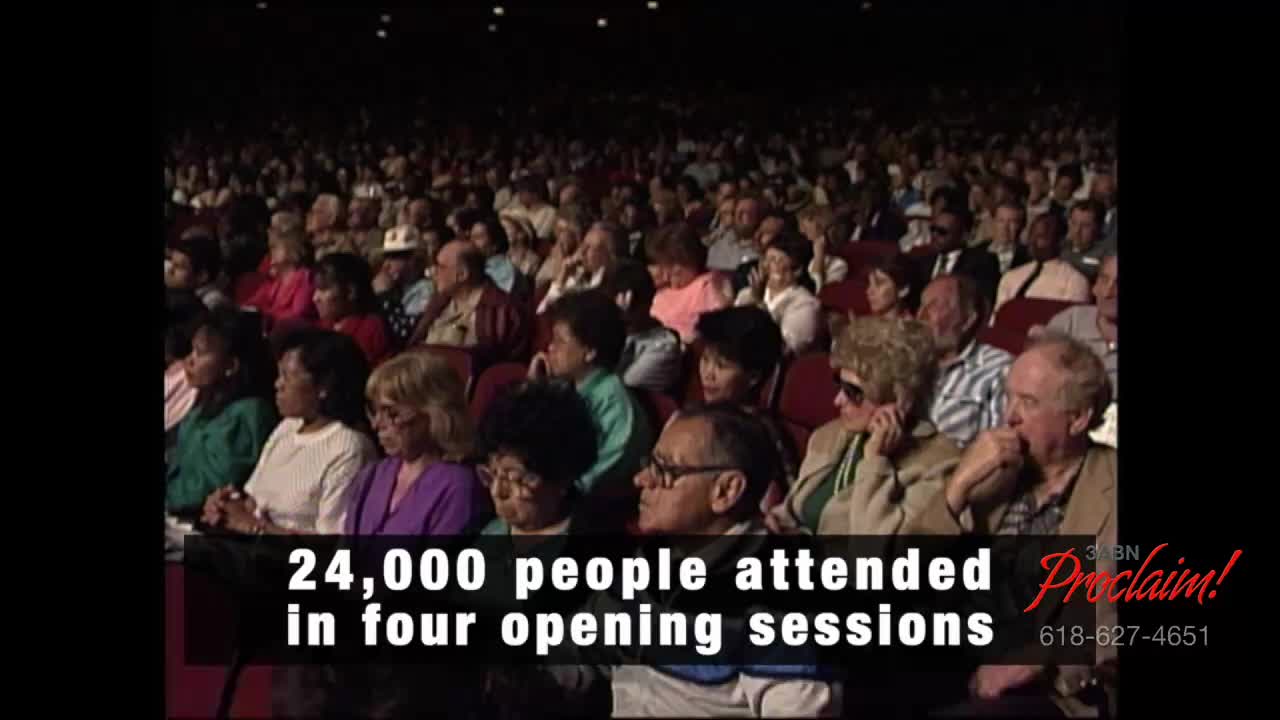 A large crowd fills the theater seats, facing forward. The 3ABN Proclaim! Network logo is in the corner, and the text states that 24,000 people attended the opening sessions.
