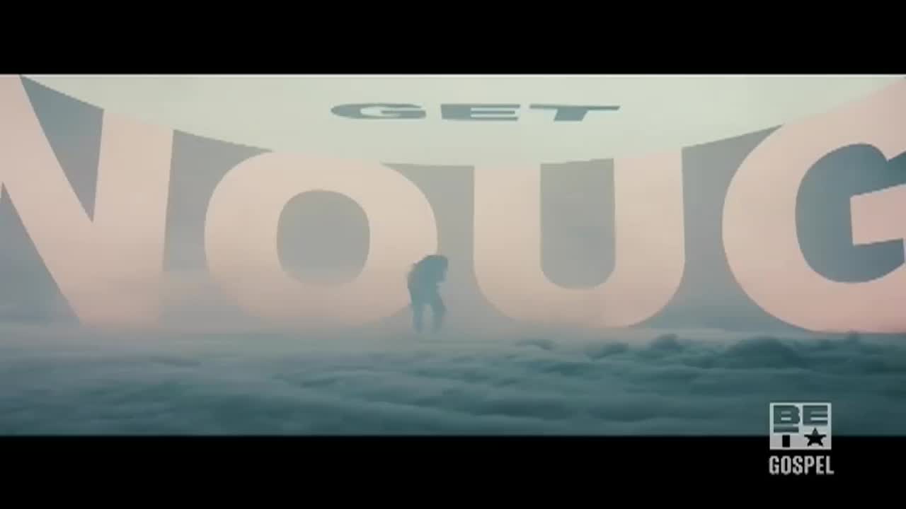 A lone figure stands silhouetted in front of the word "ENOUGH," which is formed by giant letters. The scene is shrouded in a misty, cloud-like atmosphere, with the BET Gospel logo visible in the corner.
