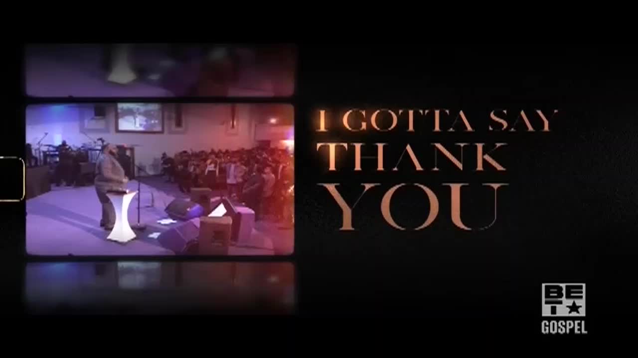A preacher stands at a podium on a stage bathed in purple light, addressing a crowd. The words "I Gotta Say Thank You" are displayed on the screen, with the BET Gospel logo in the corner.
