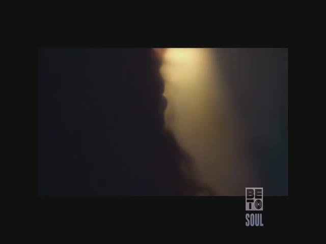 A beam of bright light cuts through a dark, hazy space. The BET Soul logo sits in the lower right corner.
