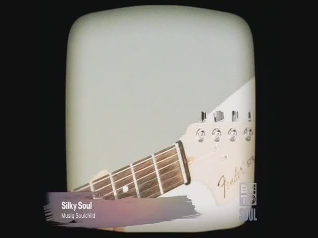 A Fender Stratocaster guitar neck is angled towards me, its headstock visible against a pale background. A BET Soul logo and the words "Silky Soul" and "Musiq Soulchild" are displayed in the lower left corner.
