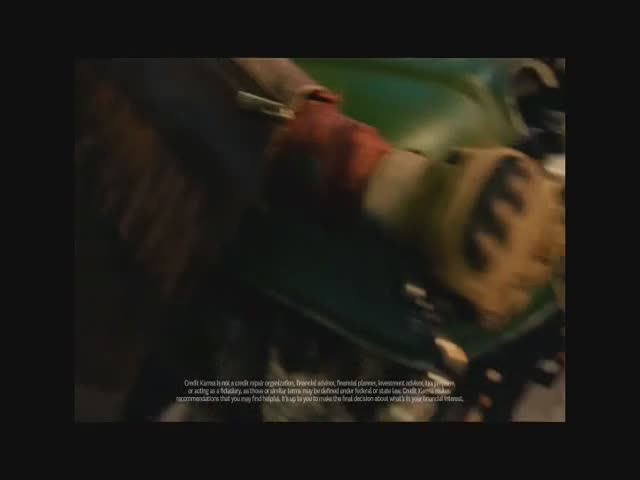 A gloved hand, clad in brown and red, grips a green motorcycle. The scene is a quick flash, likely part of a commercial on BET Soul.

