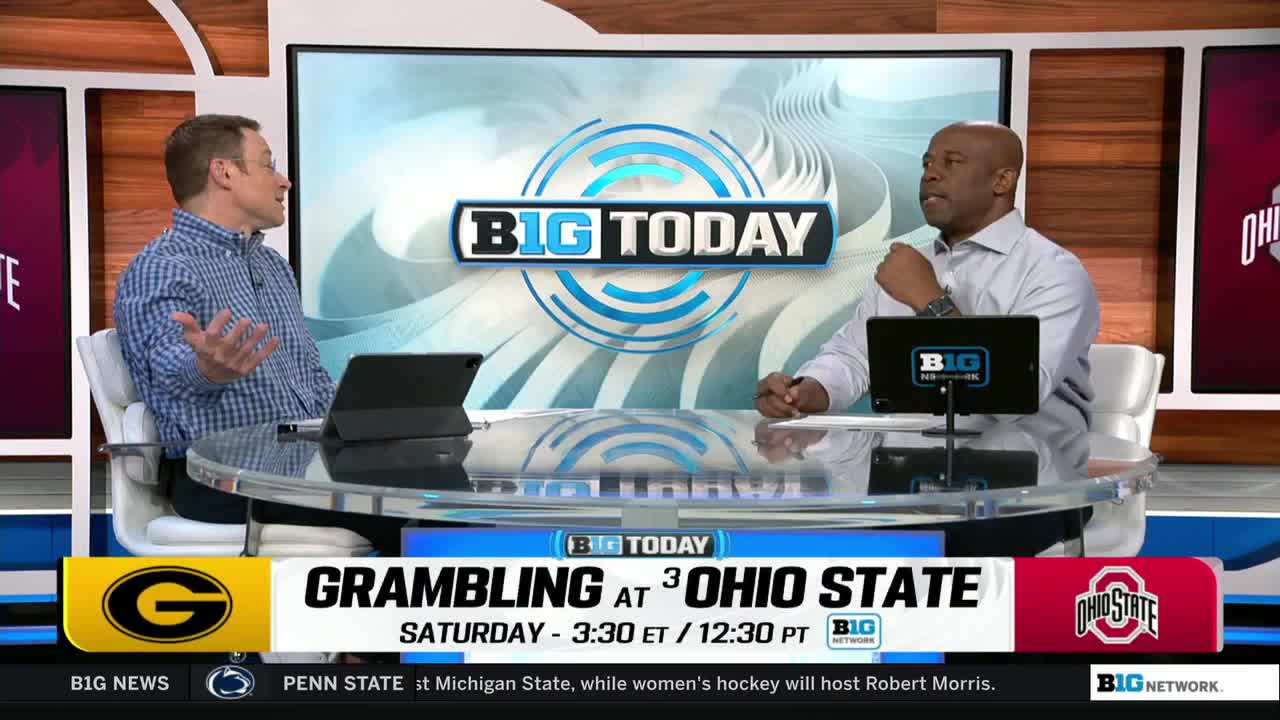 Two men are seated at a desk, discussing a game on the Big Ten Network. The screen behind them displays the "Big Today" logo and the upcoming matchup between Grambling and Ohio State.
