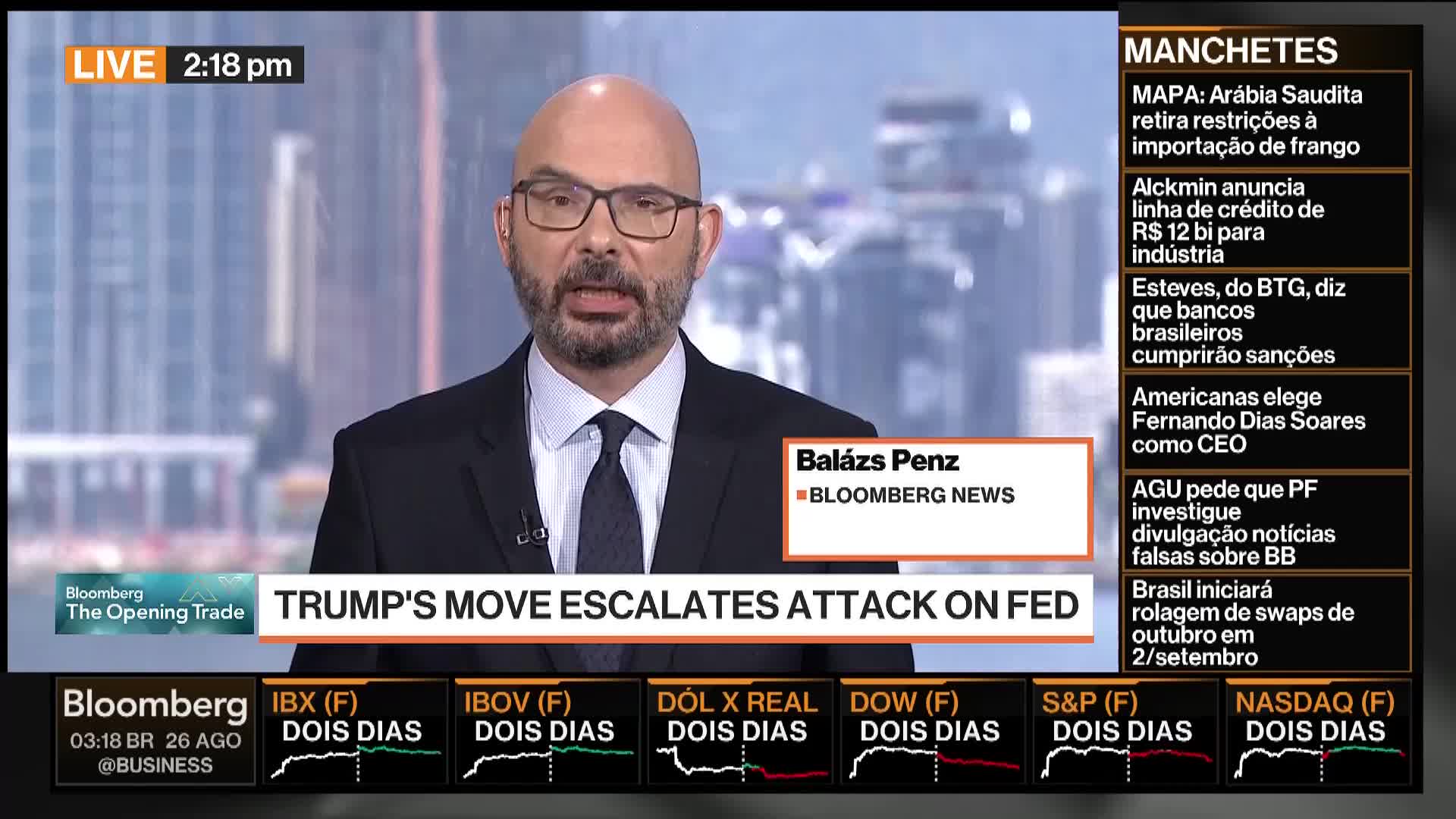 A Bloomberg News anchor, Balázs Penz, is speaking directly to the camera. The chyron announces a story about Trump's actions and their impact on the Federal Reserve.
