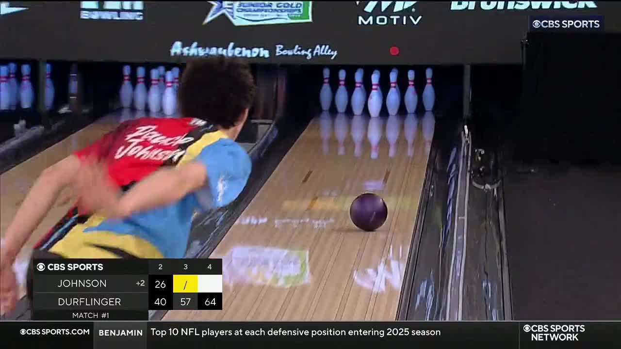 Bruce Johnson, wearing a colorful jersey, is mid-swing, the ball already released and rolling down the lane. The screen on CBS Sports Network USA shows his score and the pins standing at the end.
