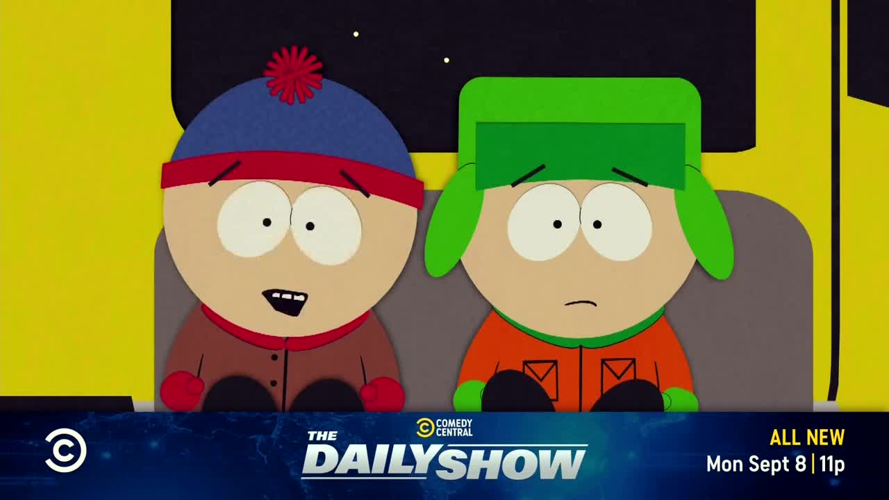 Two cartoon boys, one with a red-trimmed blue hat, the other in green, sit side-by-side. The Comedy Central logo and "The Daily Show" title card are visible at the bottom, promoting a new episode.
