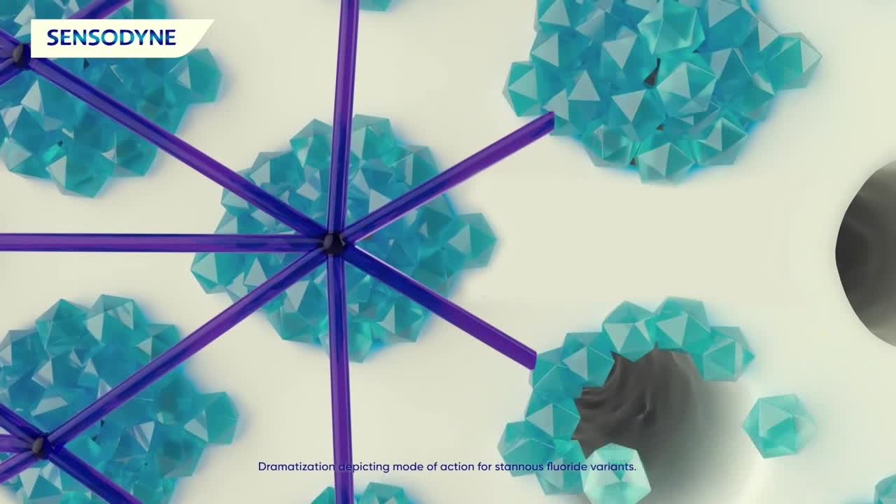 Geometric clusters of blue, faceted shapes are scattered across the white surface. Purple rods radiate from a central point, seemingly interacting with the blue formations.

