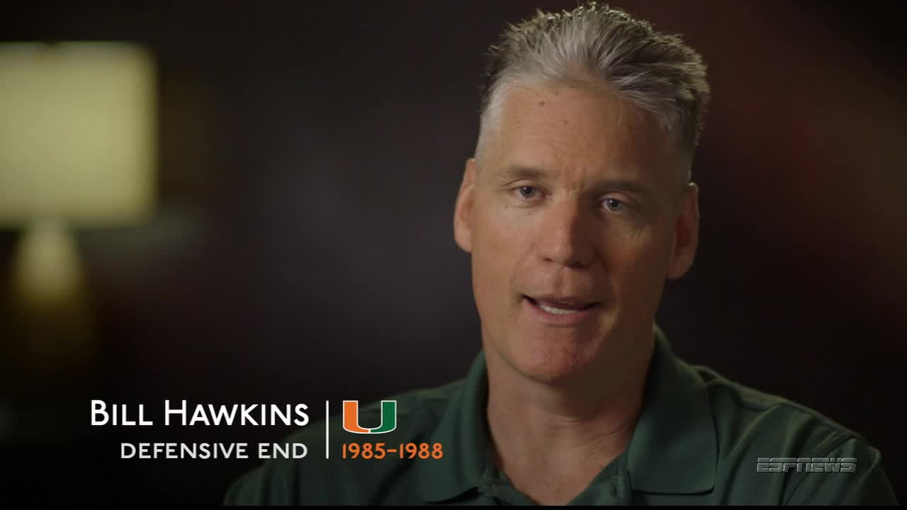 Bill Hawkins, a former defensive end for the University of Miami, is talking on ESPNews. He's wearing a green shirt, and his name and position are displayed below him.
