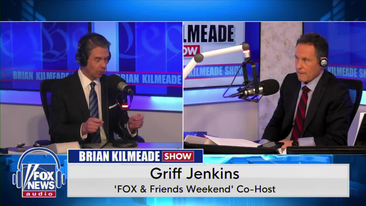 Two men in suits sit at microphones, one speaking into his, the other listening. The backdrop displays "Brian Kilmeade Show" and the Fox News Audio logo.