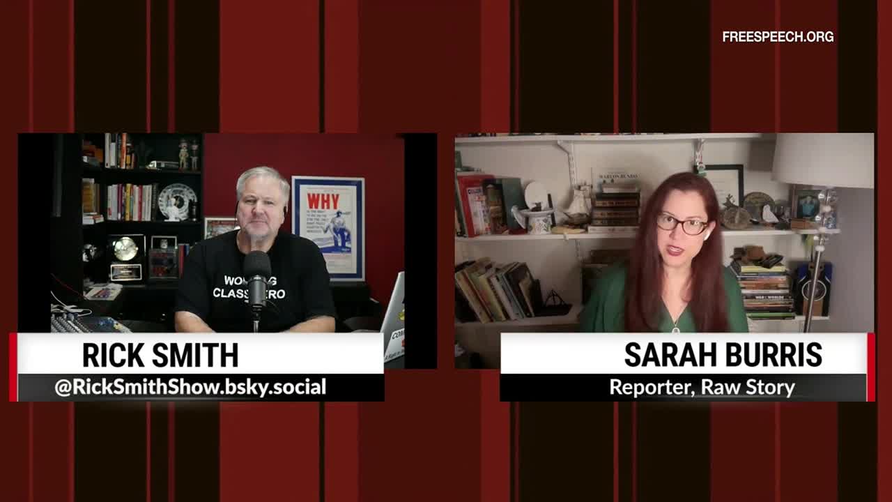 On Free Speech TV, Rick Smith sits in a home studio, while Sarah Burris, a reporter for Raw Story, appears on the right side of the screen. Both are framed against a red and black background, ready to discuss the news.

