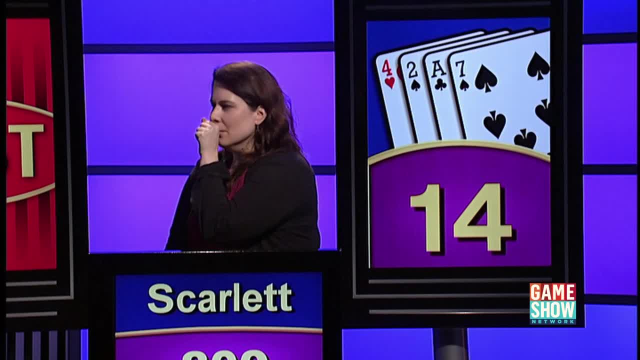 Scarlett, on the Game Show Network, is deep in thought, her hand raised to her mouth. A display shows a hand of cards with a total of 14 points.
