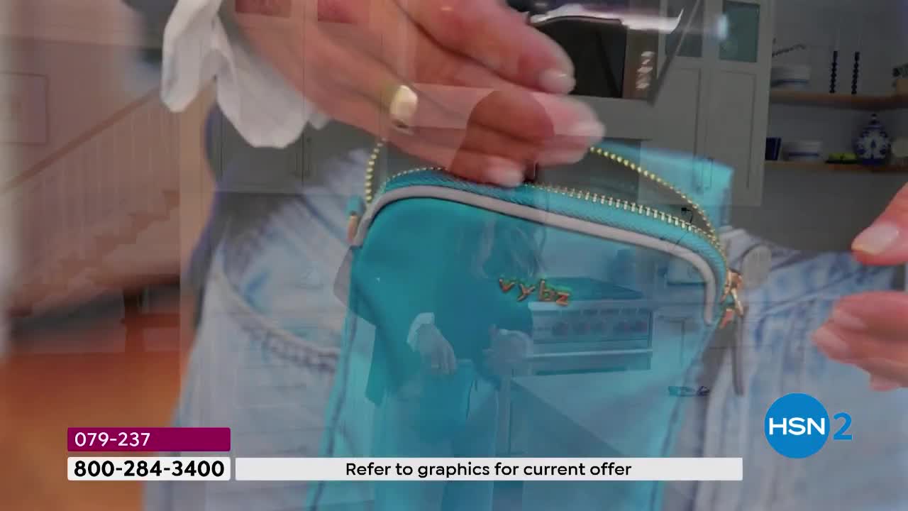 Fingers zip up a translucent teal pouch. The pouch has a gold zipper and a gold "vybz" logo.