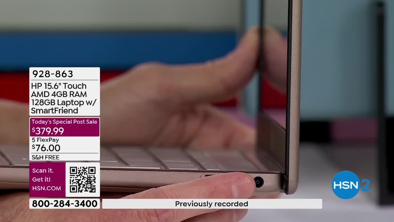 A hand gently closes the lid of a gold HP laptop. The screen displays product information and a phone number for HSN.