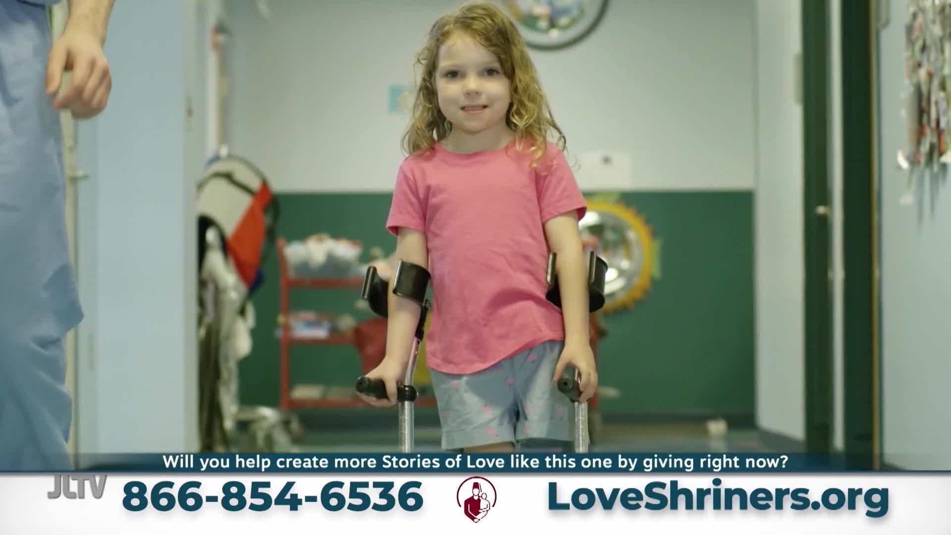 A young girl stands, gripping crutches that support her arms. She smiles directly at me, her blonde hair falling around her shoulders.