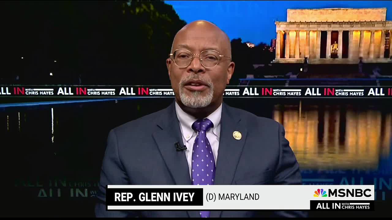 A man in a suit, identified as Representative Glenn Ivey of Maryland, is speaking on MSNBC's "All In with Chris Hayes." Behind him, the Lincoln Memorial is visible, reflected in the water.
