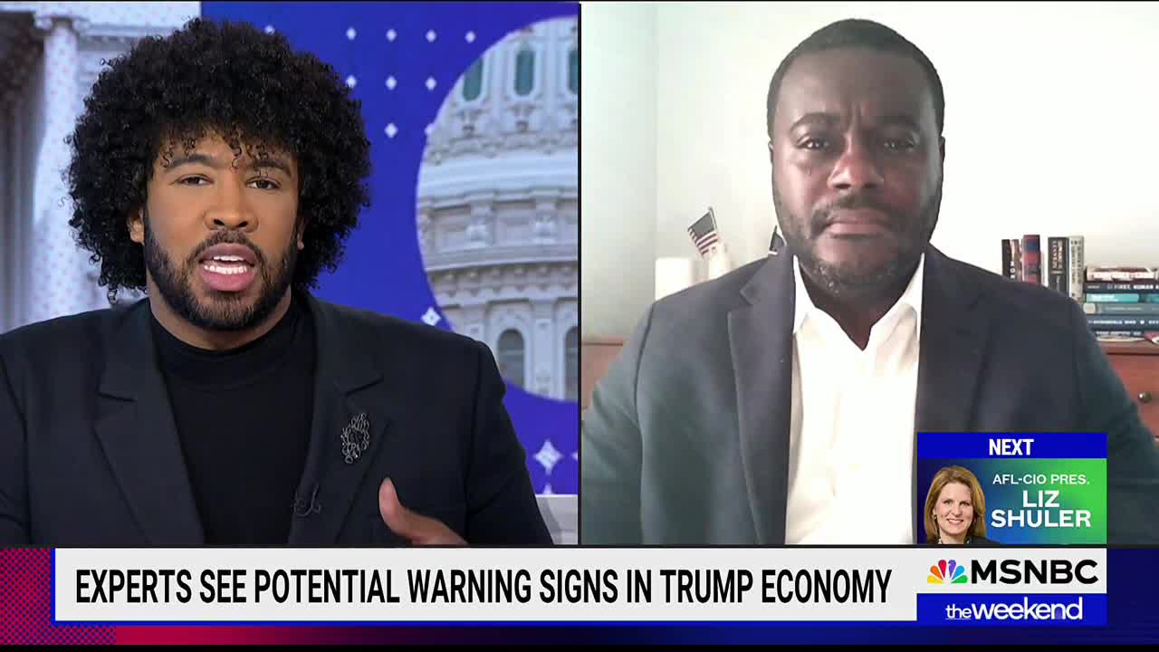 The host, on MSNBC, is speaking animatedly, gesturing with his hands. Across the split screen, a guest listens intently, framed by a home office setting.
