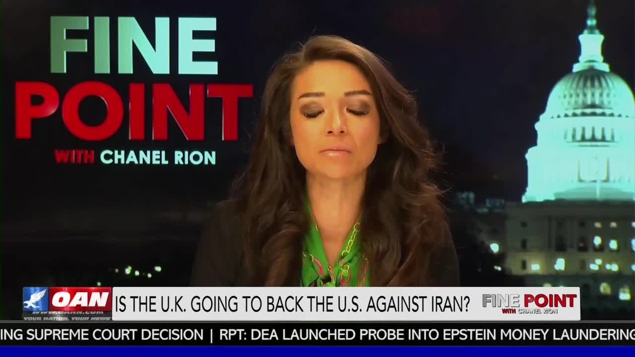 The One America News Network chyron asks if the U.K. will back the U.S. against Iran. A news anchor with dark, wavy hair looks down, her eyes closed.