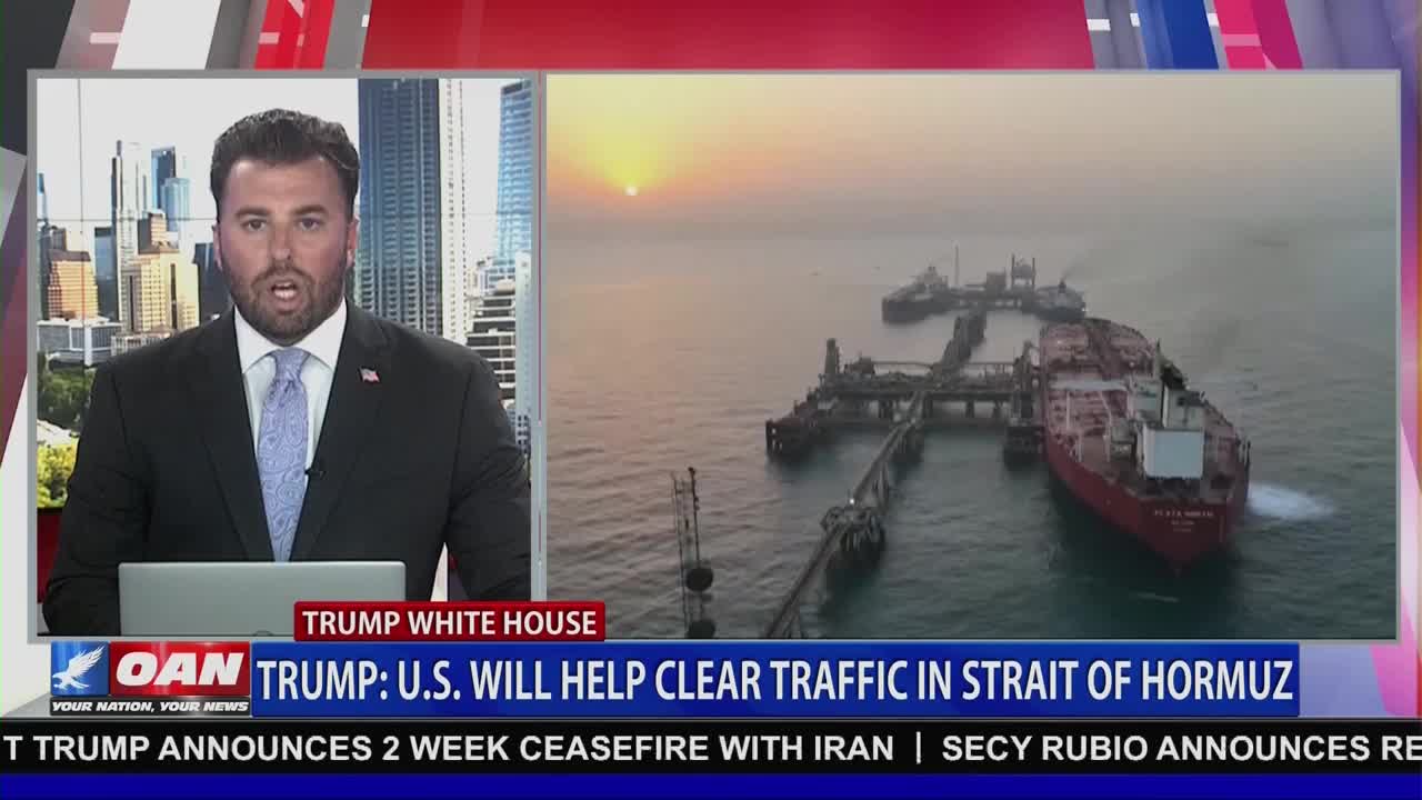 A large red tanker ship is docked at an oil terminal. The sun sets over the calm water, casting a warm glow on the scene.