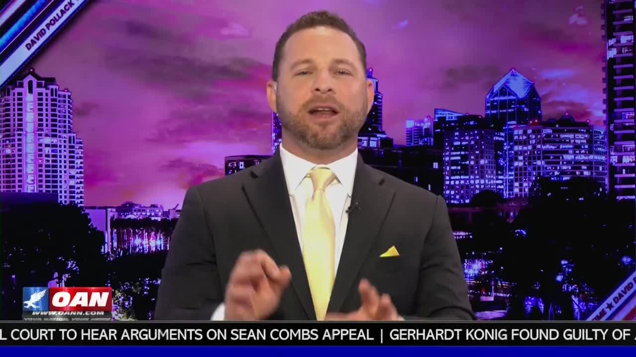 A man in a suit and yellow tie speaks with his hands raised, gesturing emphatically. Behind him, a cityscape glows under a purple sky, with the OAN logo visible in the corner.